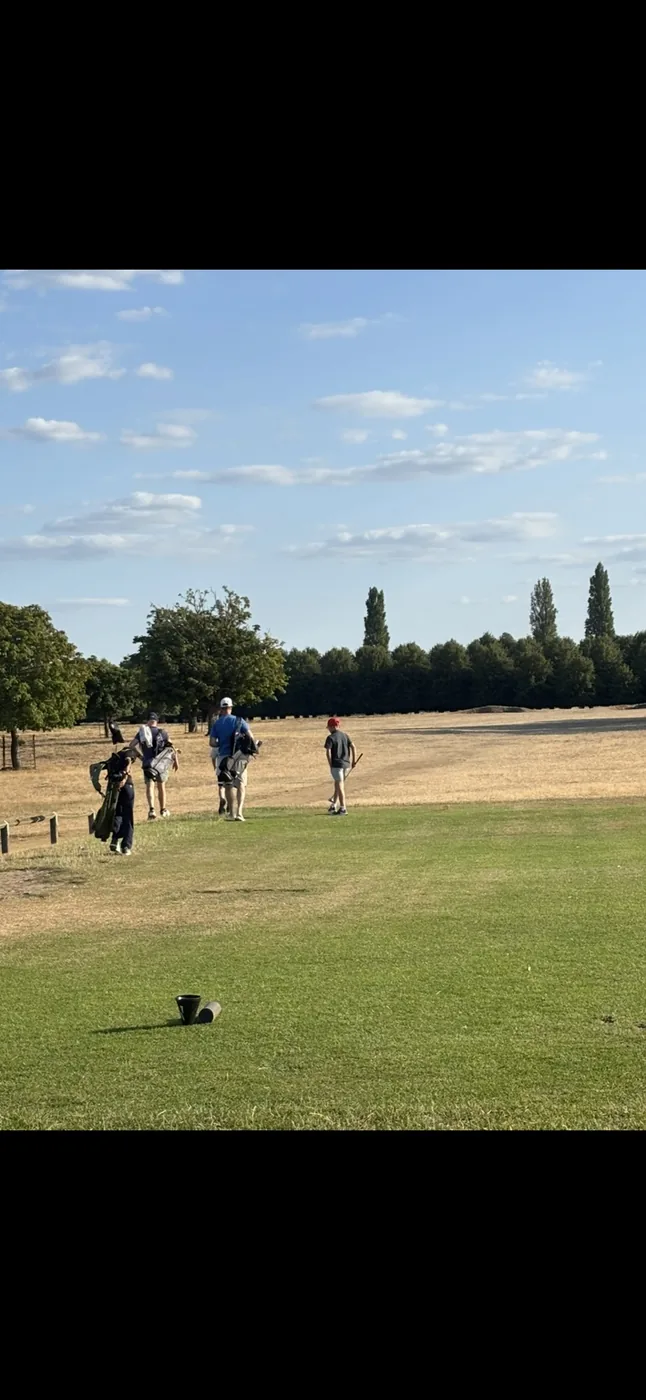 Learning to play golf on the course at Hampton Court