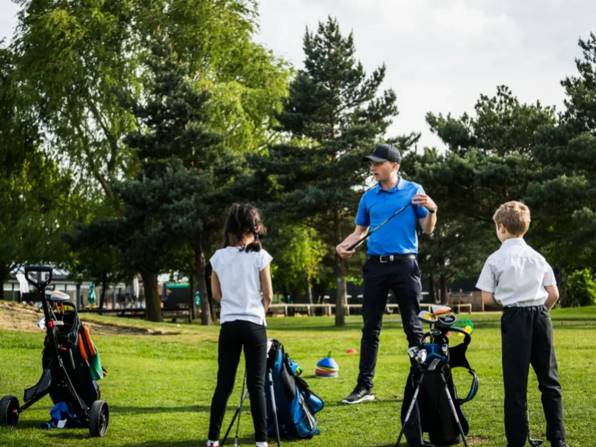 Matt Edgar coaching a junior golf group